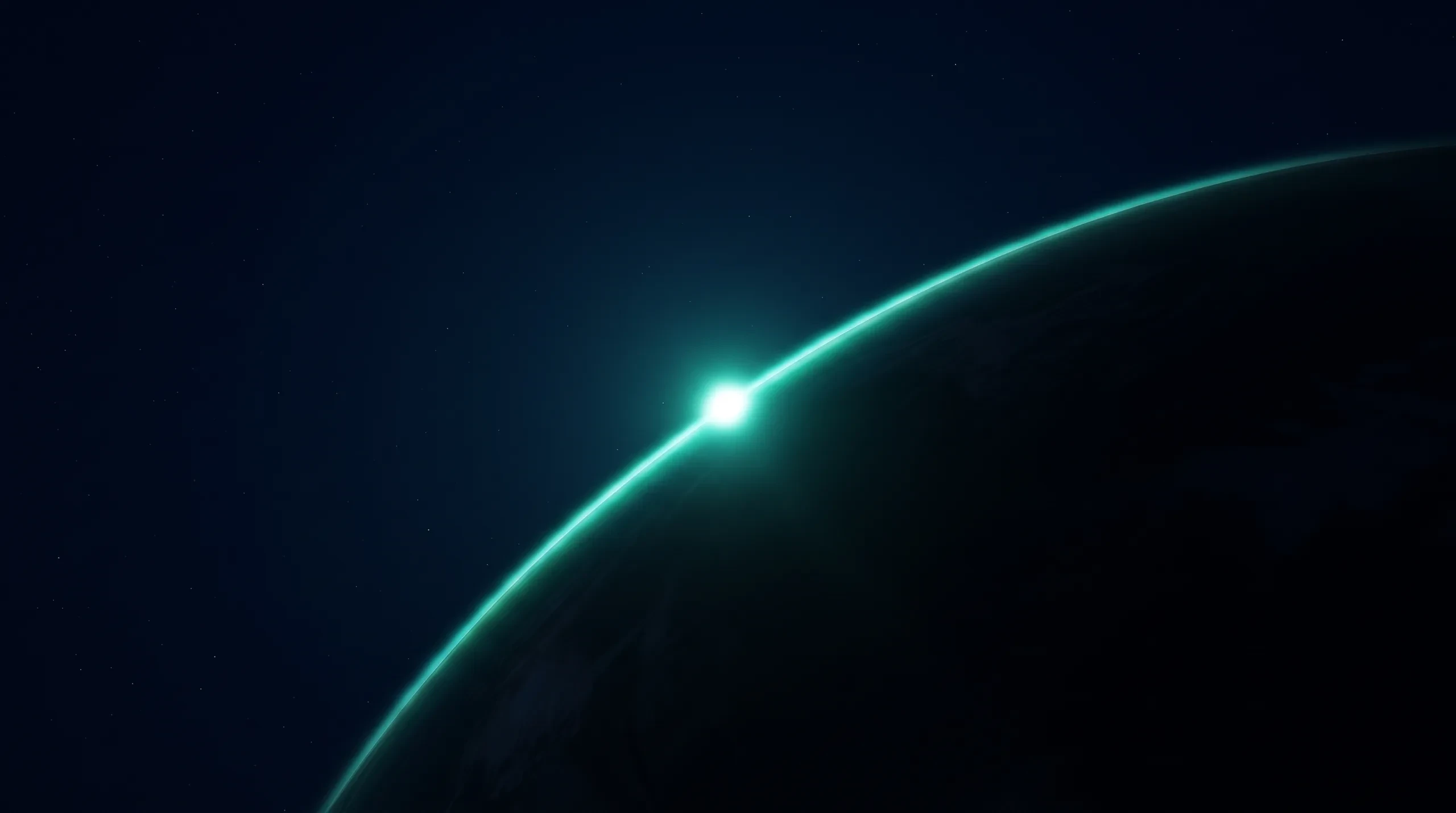 A bright point on the rim of a dark world: the moment the sun emerges.